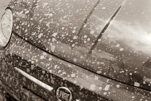 Durham, England - June 2012: A Fiat 500 car, parked in the city centre, visibly dirty with mud splashes, now dry. Neopan 400 CN