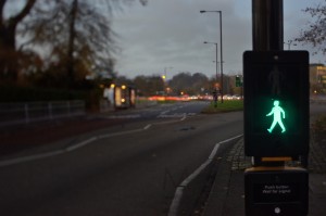 Typical English Walk/Don't walk sign, photographed in Durham at dusk. It is called "Puffin crossing" Tilted lens and selective focus.
