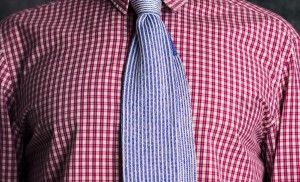 Blue woven silk tie on red cotton shirt