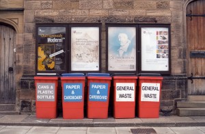 Durham, England - July 12, 2012: the bulletin boards at the University Library (Palace Green, Durham) display the posters of art and entertainment events. Tidily arranged, recycling and litter bins are aligned just below. The posters are mostly readable and include events at the Palace Green Library, arranged by Durham University. Ektar 100 film