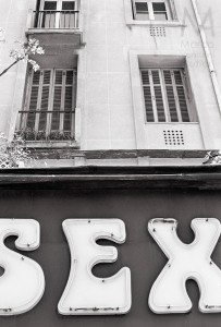 The sign of a sex shop in Nice, France, with some apartment flats above
