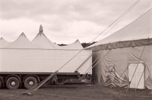 When it moves around Europe, the circus needs plenty of vehicles and trucks to carry stuff and artists around. Photographed in England, Sept. 2012  Neopan 400
