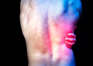 My back is painful and it shows! Red light illustrates back pain.