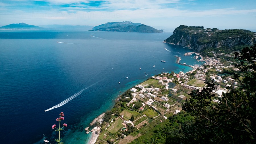 Marina Grande, together with the Italian coast (Costiera Amalfitana and Penisola Sorrentina), are a long-shot that immediately identifies the place. You cannot use this image to describe any place but Capri 