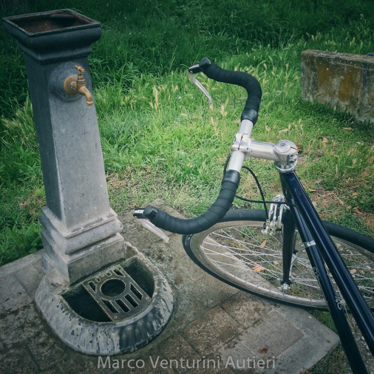 Since my bike is so gorgeous, including it in the frame comes natural. Public drinking fountain near the ancient aqueduct of Asciano