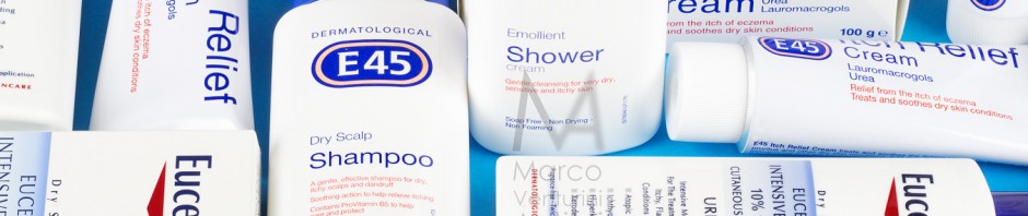 I photographed this with my Sony NEX-5 and a tilted (via Lensbaby) Zenzanon PS lens. Two different brands, present in the British market for skin care products, adopt colour branding extremely similar (red, blue and white) and even similarly shaped bottles: they are Eucerin and E45. This photograph, taken in my home, shows four product, with and without box: E45 Itch Relief skin cream, Eucerin lotion, E45 shampoo, E45 Shower.