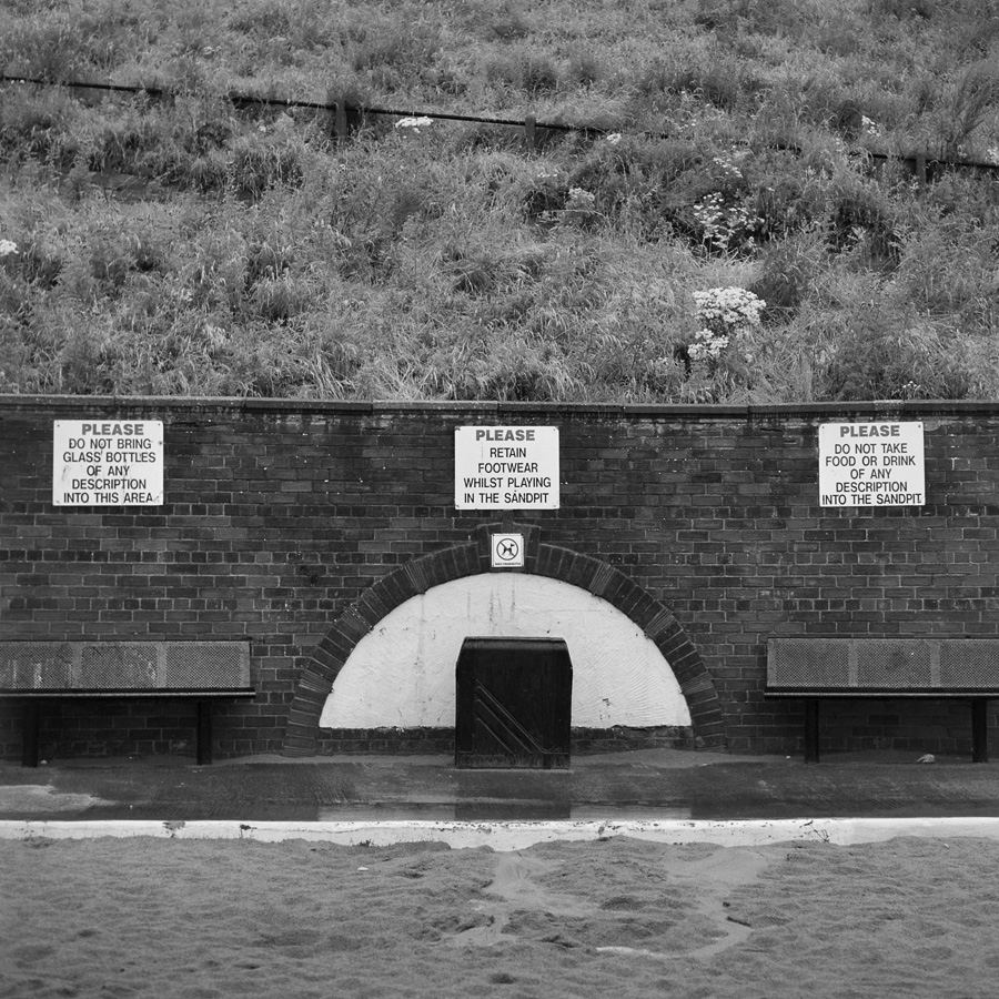 Please do not - Long list of English interdictions English society is constellated by interdictions and "please do not". In this public space (Roker beach, Sunderland), you can read four: 1. Please do not bring glass bottles of any description into this area 2. Please retain footwear while playing in the sandpit 3. Please do not take food or drink of any description into the sand 4. Dogs prohibited